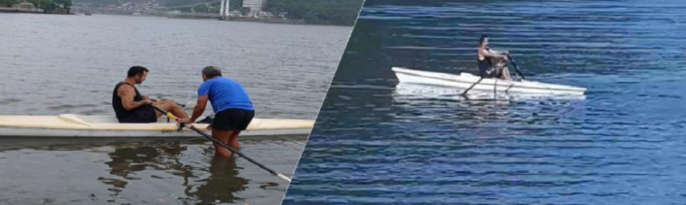 Imagem de pessoas remando com nossos barcos em São Vicente próximo a Ponte Pensil